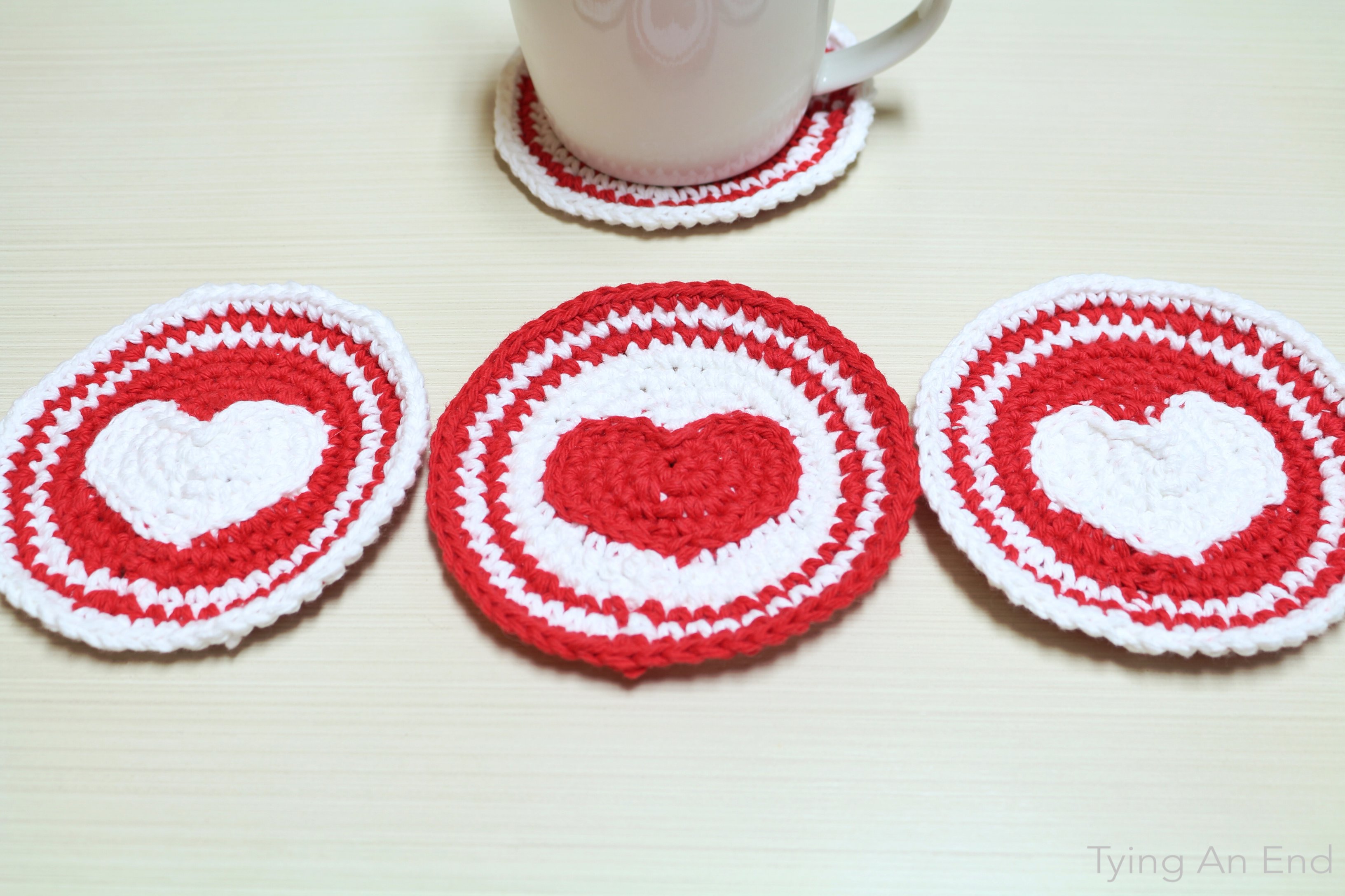 [Free Crochet Pattern] Perfect for Valentine's Day gift! Put a little love on the table and to the drink. Heart Crochet Coaster by Tying An End