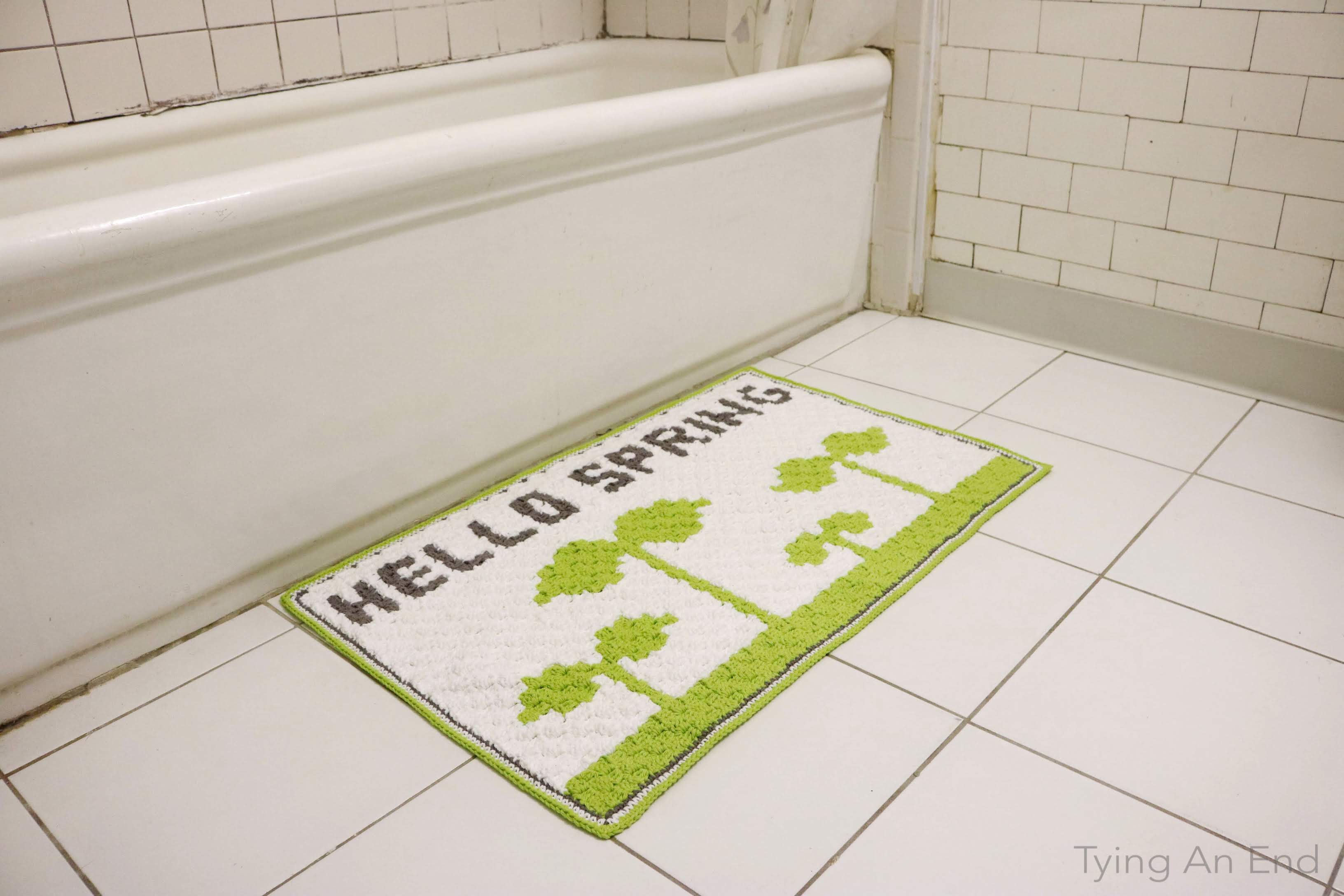 [Free Crochet Pattern] We were all waiting for beautiful spring weather to come after long cold winter. Warm yourself up from both inside and outside with this cute bath mat! Hello Spring Bath Mat by Tying An End