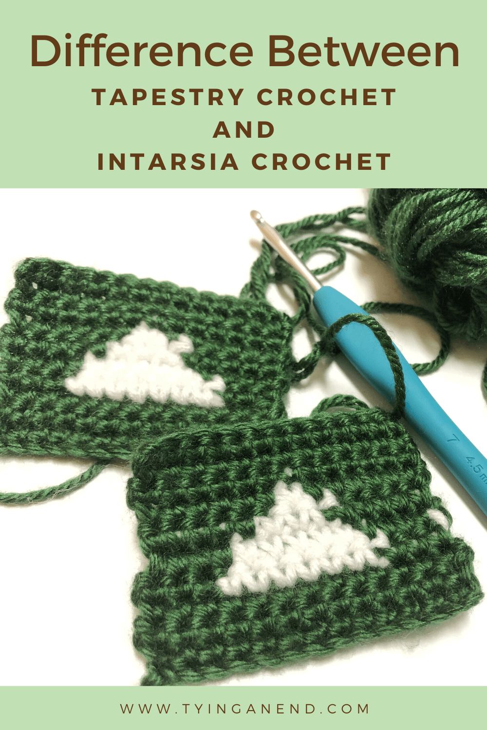 Green and white crochet triangle motif with sky blue crochet hook with a word difference between tapestry crochet and intarsia crochet