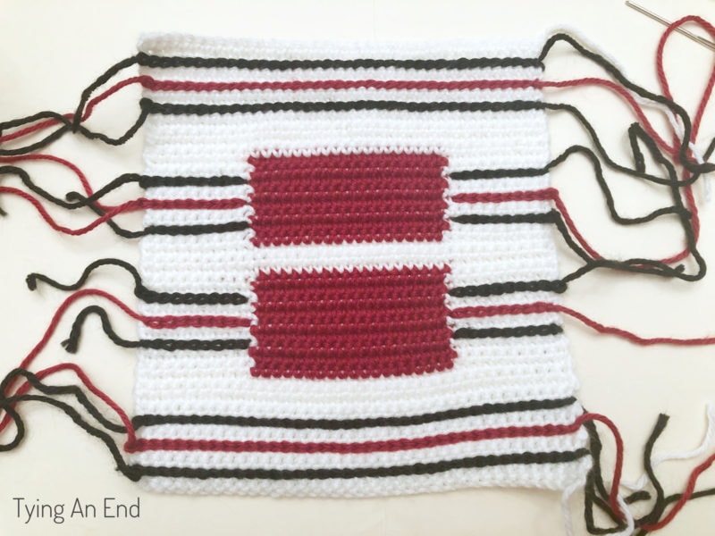 crochet plaid pattern design using surface slip stitch with red gift box pattern