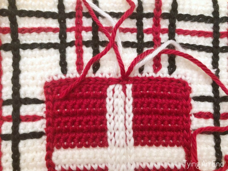 crochet plaid pattern design using surface slip stitch with red gift box pattern