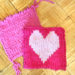 yarn craft with kids finger knitting heart and pink square